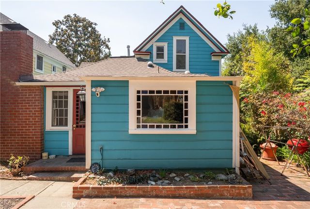an aerial view of a house with a yard