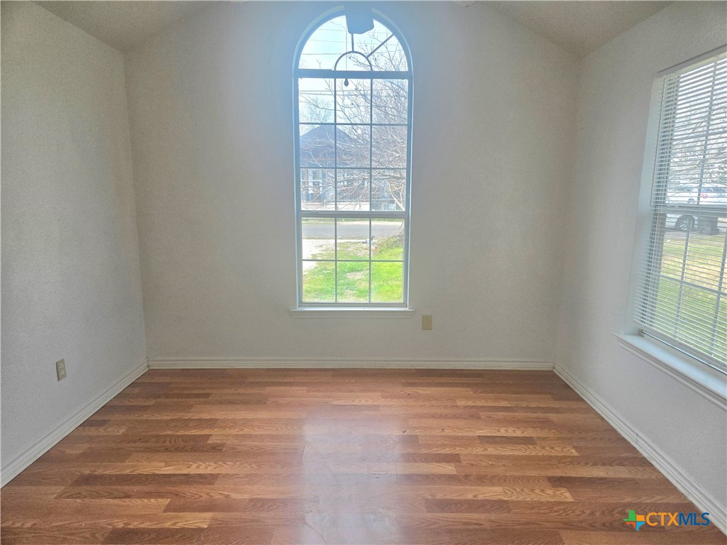 819 South 16th Street Temple, TX 76501 - Photo 3 of 7 an empty room with a window