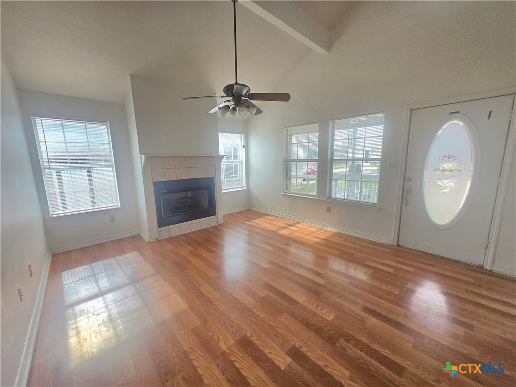 819 South 16th Street Temple, TX 76501 - Photo 7 of 7 a view of empty room with fireplace and wooden floor