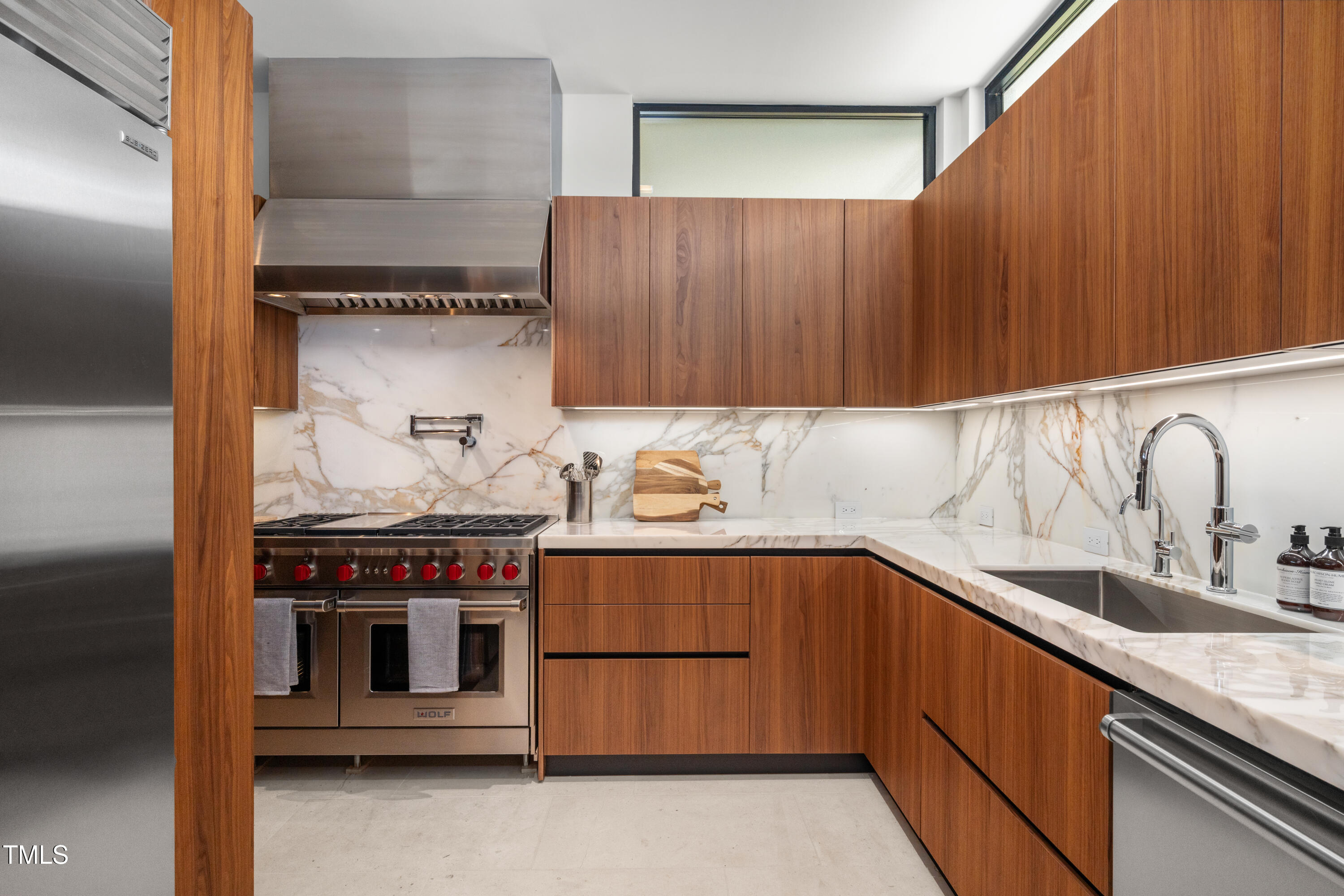 812 Stradella Road Raleigh, NC 27614 - Photo 14 of 35 a kitchen with stainless steel appliances granite countertop a sink and a stove