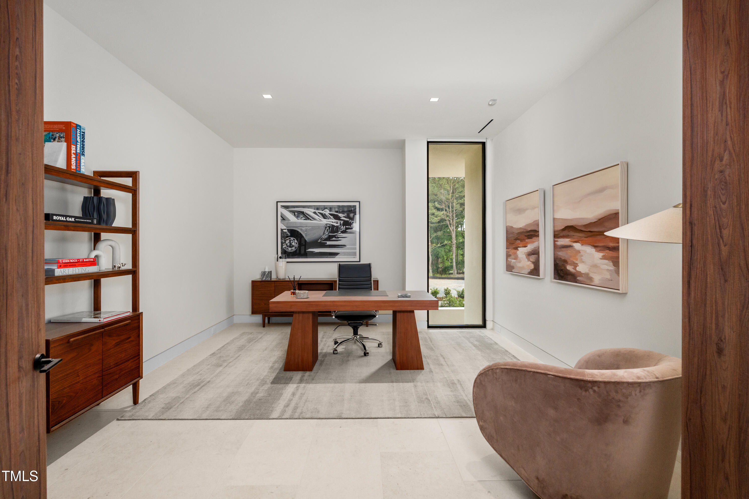 812 Stradella Road Raleigh, NC 27614 - Photo 21 of 35 a living room with furniture and a book shelf