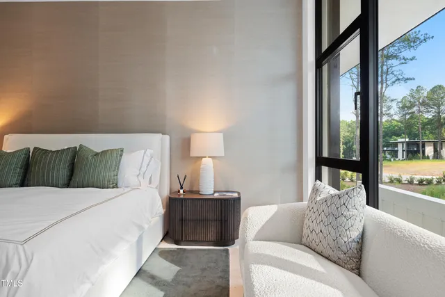 a bedroom with a bed and a couch