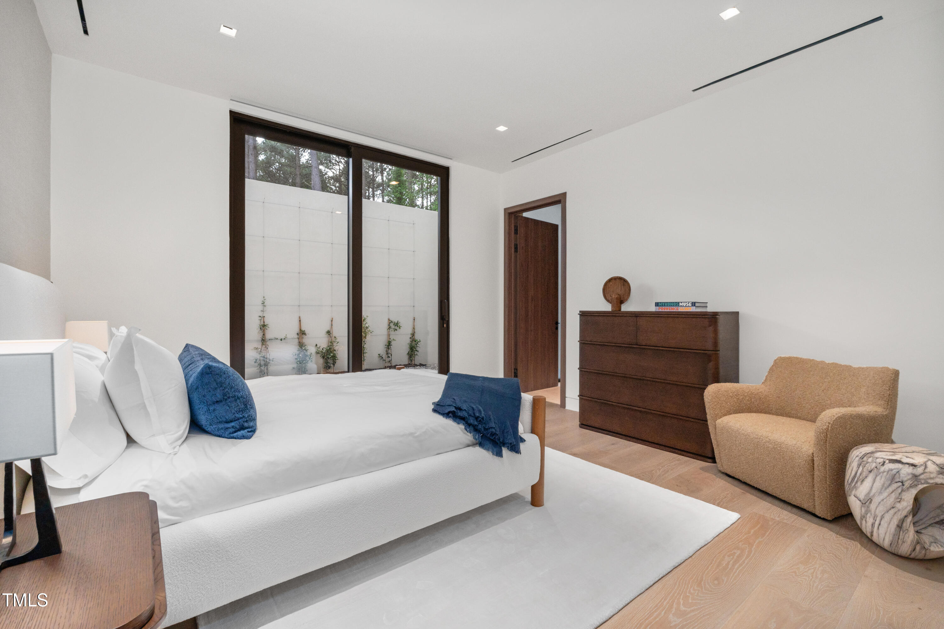 812 Stradella Road Raleigh, NC 27614 - Photo 27 of 35 a bedroom with bed and a large window