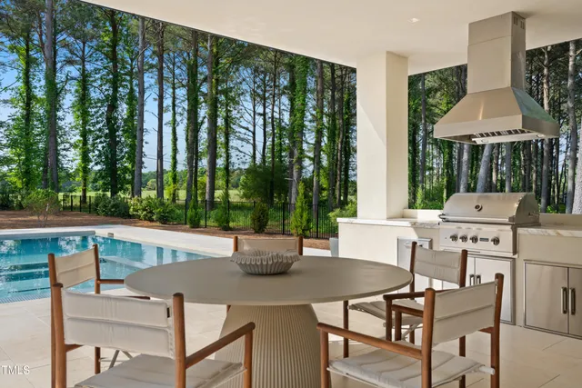 a view of a house with a yard and a garden