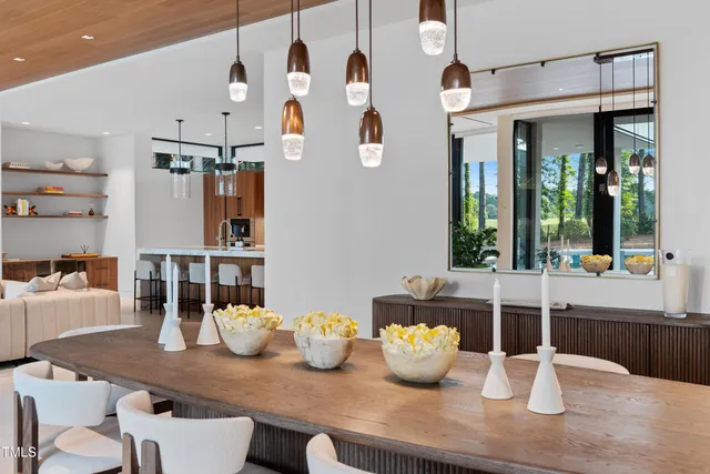 a kitchen with a table and chairs