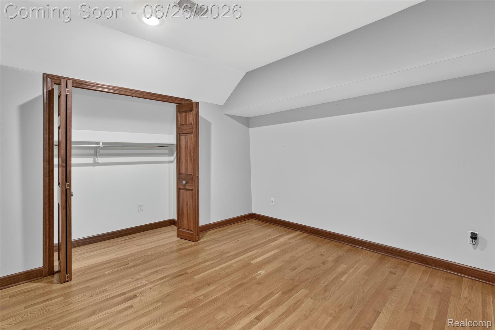3478 Lexington Road Waterford, MI 48328 - Photo 27 of 52 Room featuring wood-finish flooring, white walls, and a recessed ceiling light