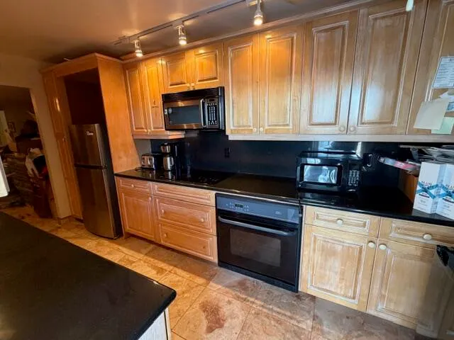 a view of a swimming pool with a yard