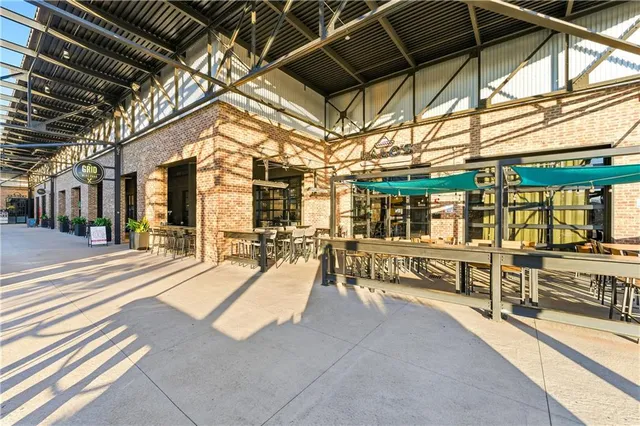 a view of a patio with a table and chairs