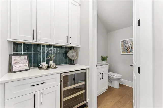 a bathroom with a sink a toilet and vanity