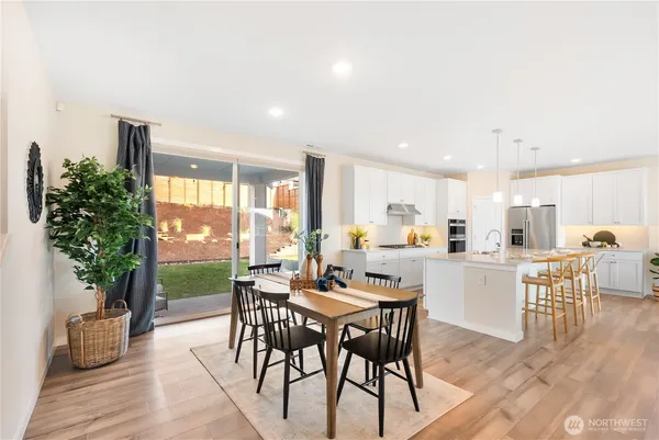 a kitchen with a table and chairs in it