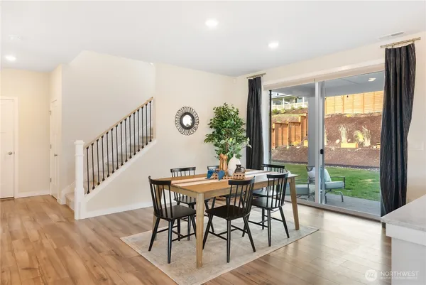 a view of a dining room with furniture window and wooden floor
