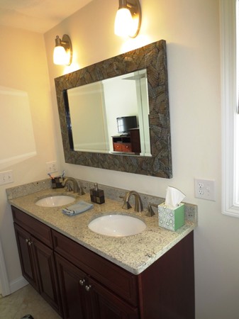 5 Wilbur Road Lincoln, RI 02865 - Photo 15 of 30 a bathroom with a granite countertop sink and a mirror