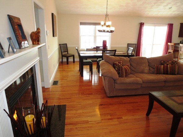 5 Wilbur Road Lincoln, RI 02865 - Photo 5 of 30 a living room with furniture wooden floor and a fireplace