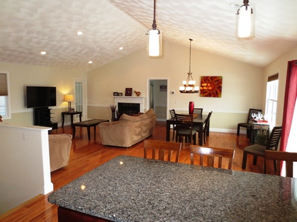 5 Wilbur Road Lincoln, RI 02865 - Photo 8 of 30 a living room with fireplace furniture and a flat screen tv