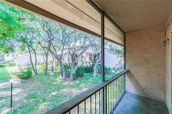a view of a porch with a backyard