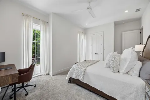 a bedroom with a large bed and a window