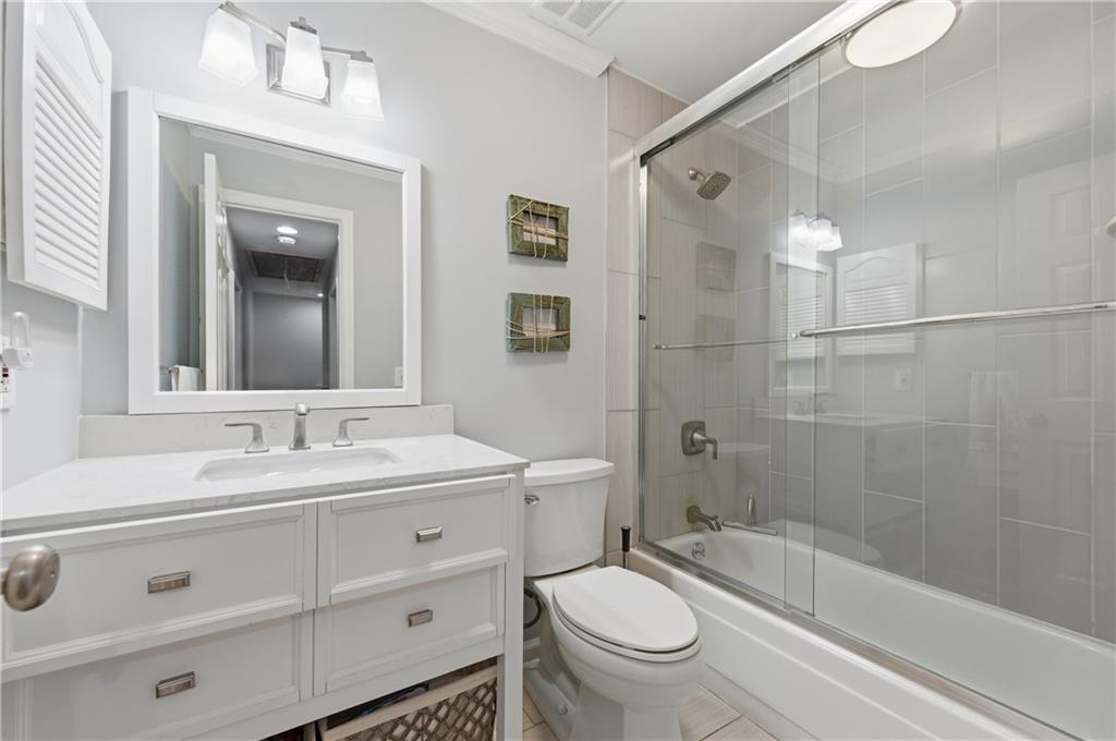 1102 Moorestown Circle Decatur, GA 30033 - Photo 12 of 13 a bathroom with a bathtub shower sink vanity mirror and toilet