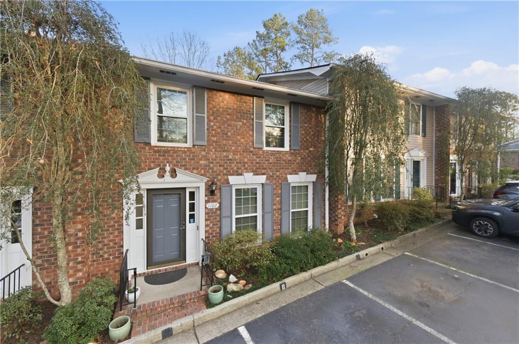 1102 Moorestown Circle Decatur, GA 30033 - Photo 13 of 13 a view of a brick house with a yard and plants