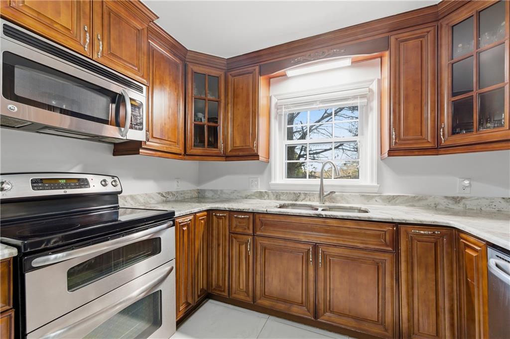 1102 Moorestown Circle Decatur, GA 30033 - Photo 6 of 13 a kitchen with stainless steel appliances granite countertop a sink and a microwave