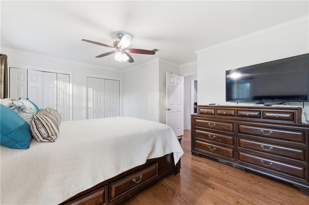 1102 Moorestown Circle Decatur, GA 30033 - Photo 9 of 13 a bedroom with a bed and a chandelier