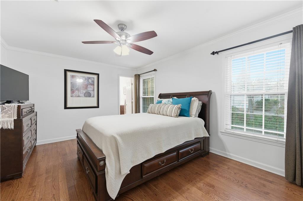 1102 Moorestown Circle Decatur, GA 30033 - Photo 10 of 13 a bed sitting in a bedroom next to a window