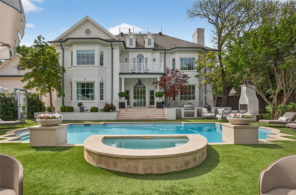 6331 Waggoner Drive Dallas, TX 75230 - Photo 26 of 36 a view of a house with a yard patio and swimming pool