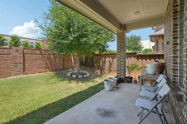 a view of backyard with seating space