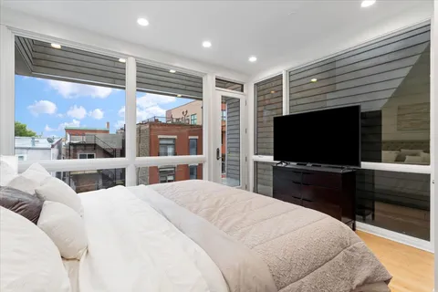 a view of balcony with wooden floor and fence