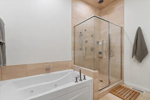 a bed room with a bed and a chair