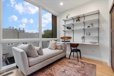 a view of balcony with wooden floor