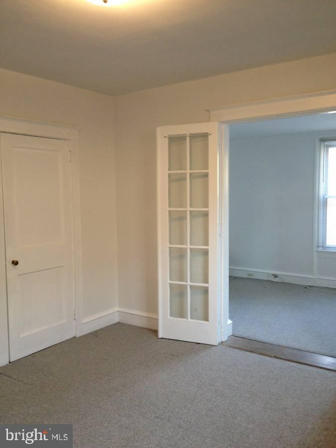 100 South Valley Road, Unit 1A Paoli, PA 19301 - Photo 2 of 11 a view of an empty room with a window