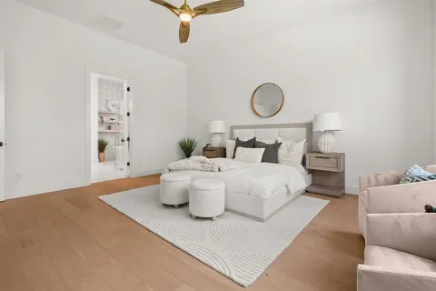 a bedroom with a bed and chandelier
