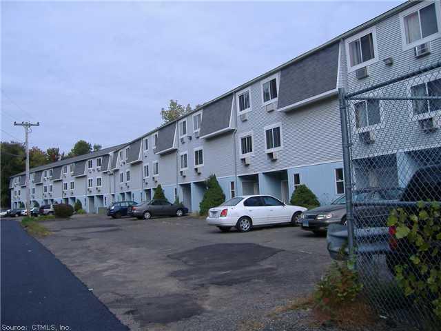 168 Mulloy Road, Unit 3 Waterbury, CT 06705 - Photo 1 of 1 a car parked in front of a building