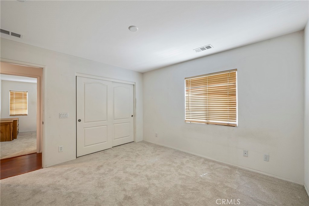 3819 St Austell Way Perris, CA 92571 - Photo 39 of 64 a view of an empty room with a window