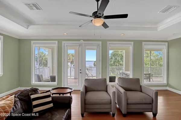 a view of an entryway with wooden floor