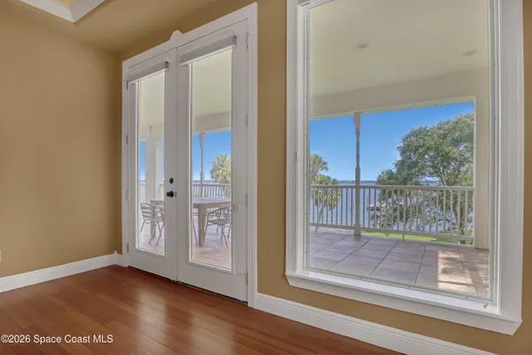a view of a patio with a table chairs and backyard