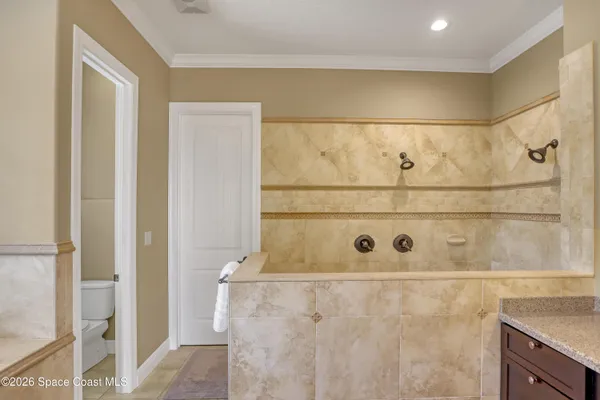 a view of a patio with a dining table and chairs