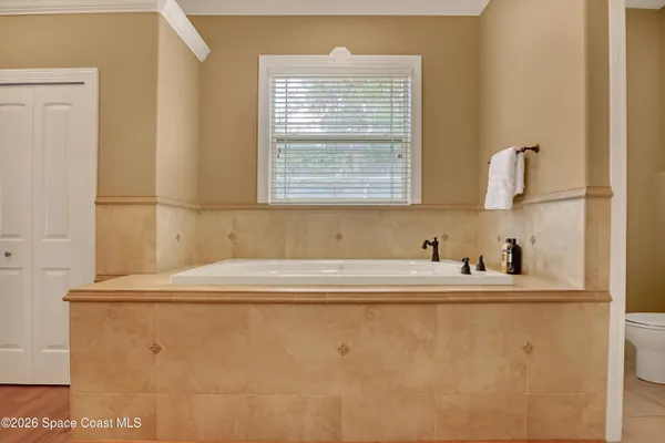 a view of a patio with a table and chairs