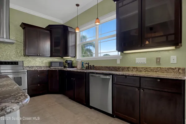 an empty room with a window and wooden floor
