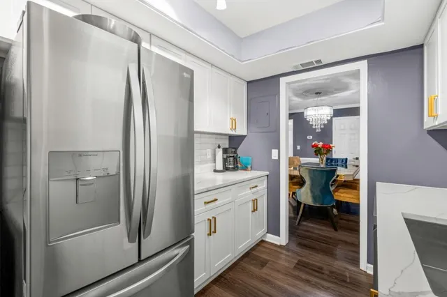 a kitchen with granite countertop a stove and a sink