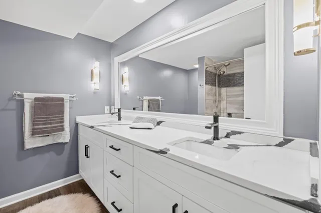 a bathroom with a bathtub and shower