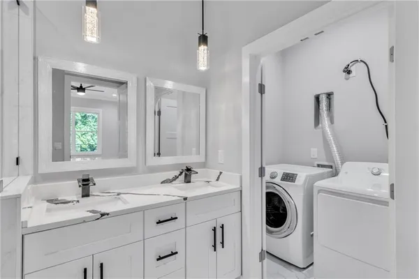 a bathroom with a sink a toilet and a bathtub