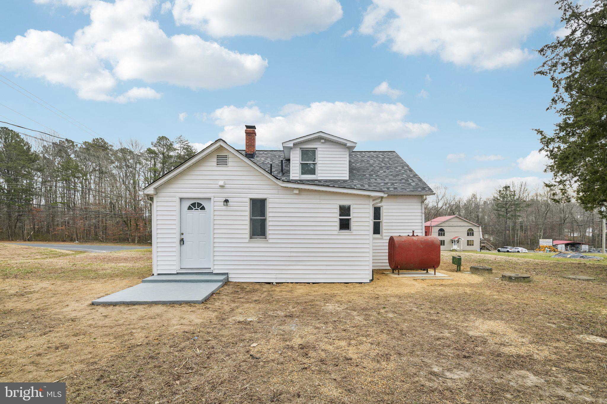 24399 Morgan Road Hollywood, MD 20636 - Photo 2 of 40 a view of a house with a yard