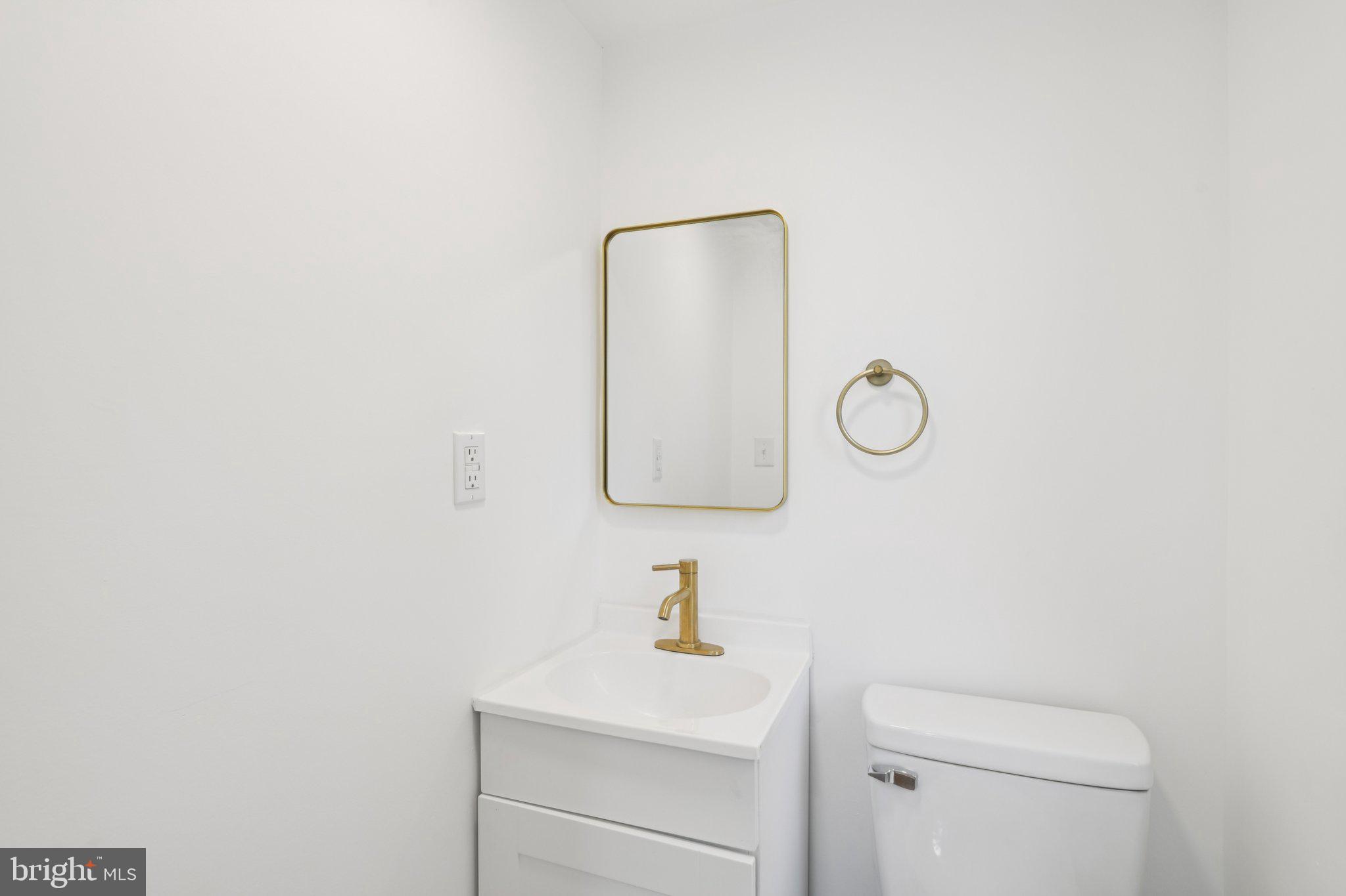 24399 Morgan Road Hollywood, MD 20636 - Photo 24 of 40 a bathroom with a sink and a mirror