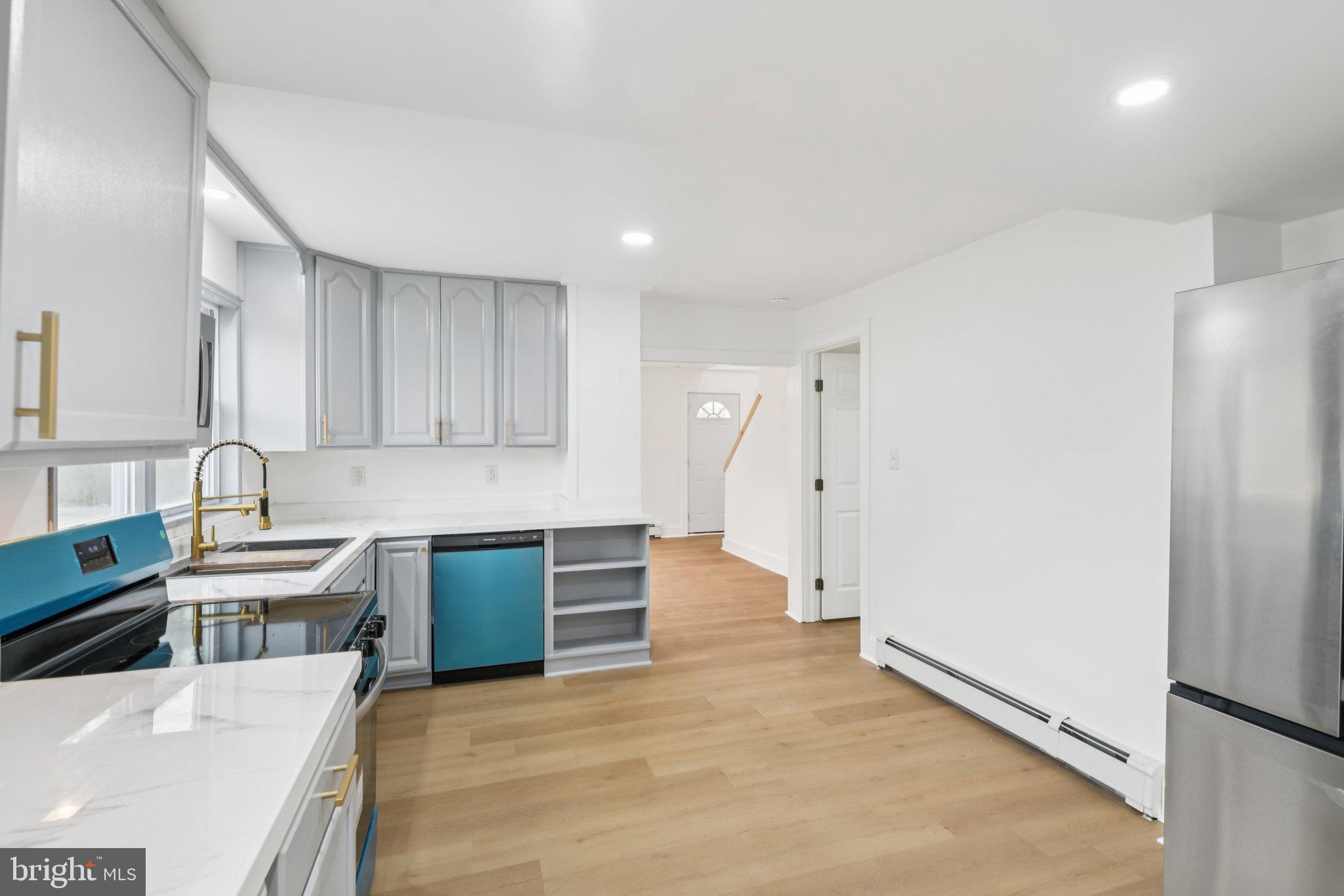 24399 Morgan Road Hollywood, MD 20636 - Photo 26 of 40 a kitchen with granite countertop a refrigerator and a sink
