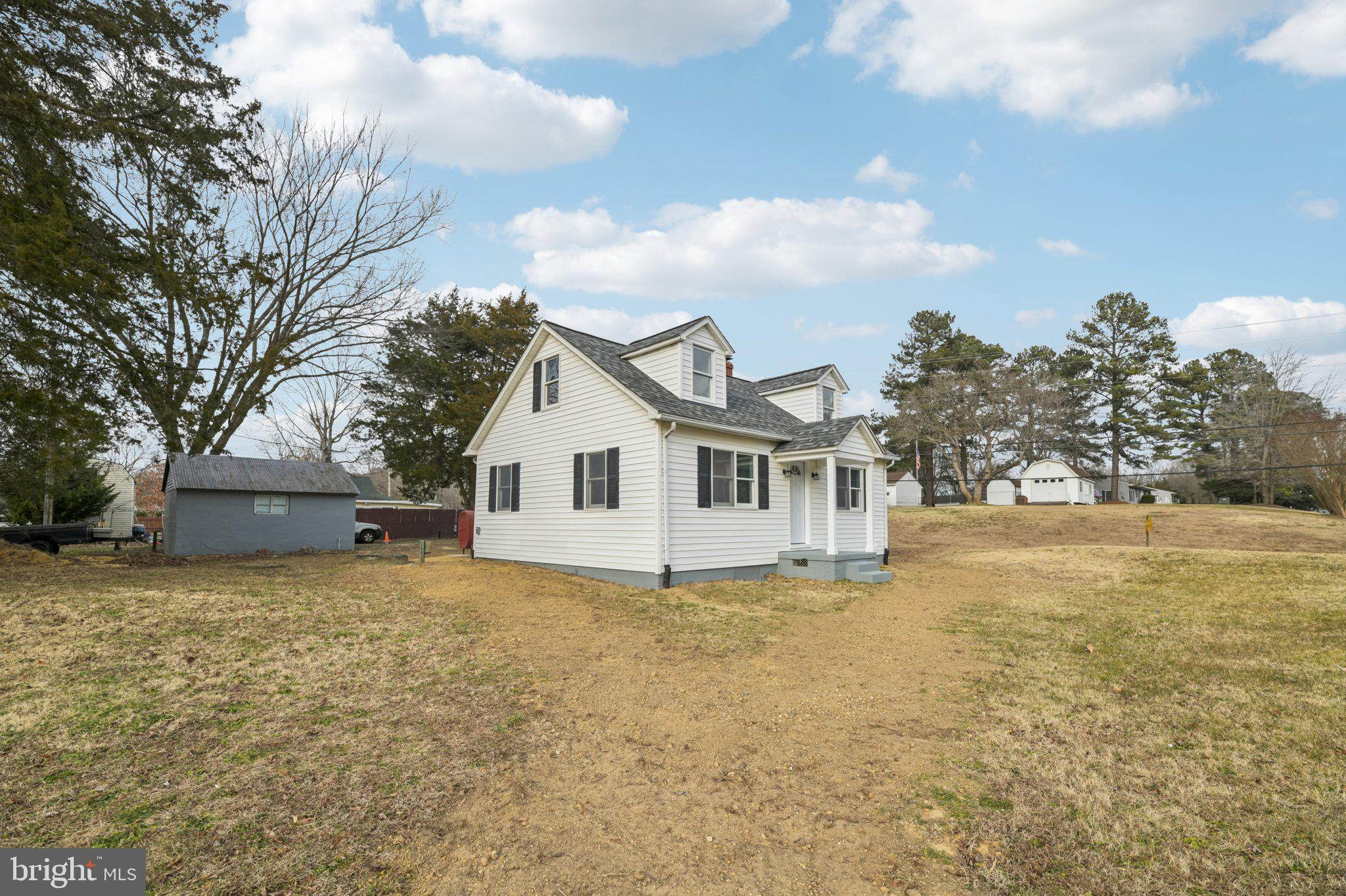 24399 Morgan Road Hollywood, MD 20636 - Photo 4 of 40 a view of a house with a yard