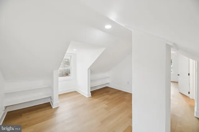 a view of an empty room with stairs