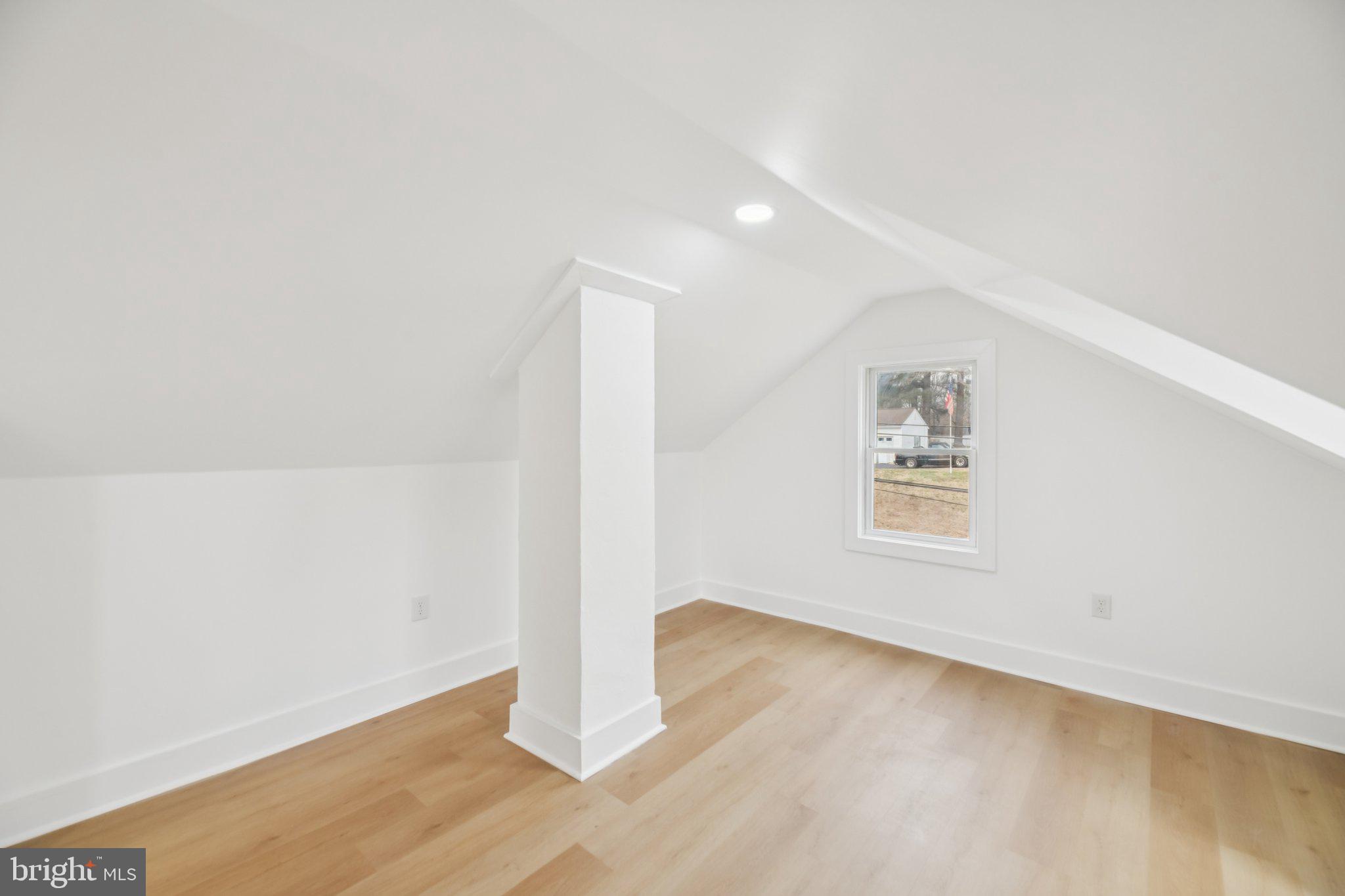 24399 Morgan Road Hollywood, MD 20636 - Photo 10 of 40 an empty room with wooden floor and windows