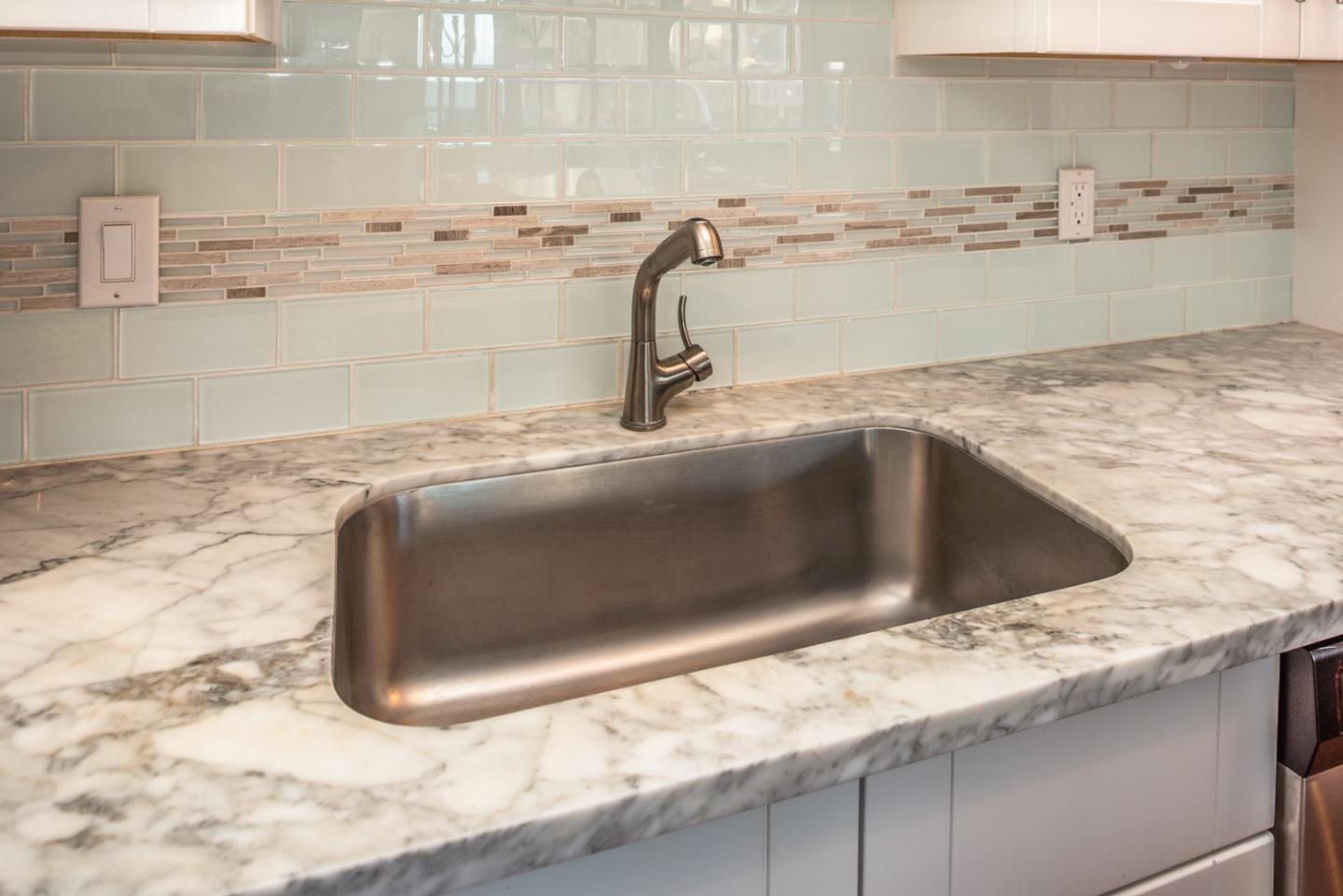 1 Surf Way, Unit 225 Monterey, CA 93940 - Photo 11 of 32 a view closed with granite countertop a sink and vanity