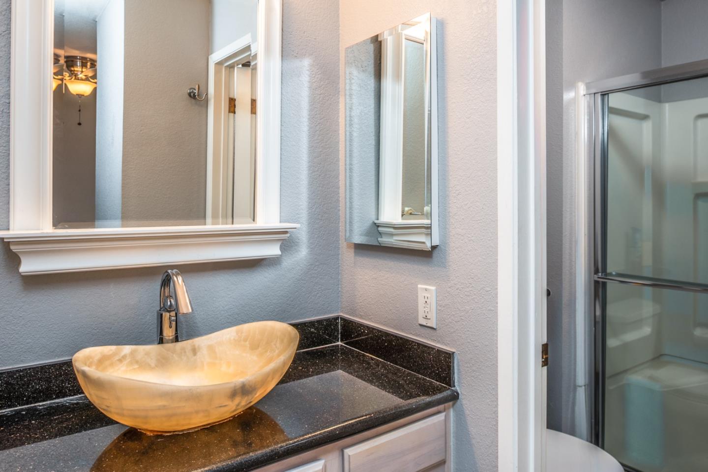 1 Surf Way, Unit 225 Monterey, CA 93940 - Photo 14 of 32 a bathroom with a sink